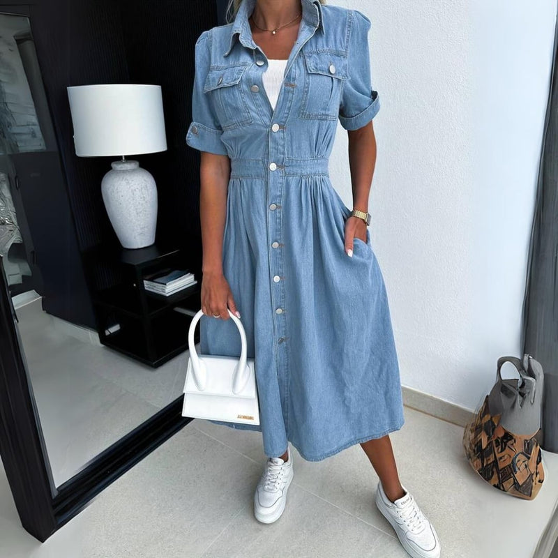 Close-up of the full button-front closure and snap-close chest pocket flaps on the Jade denim midi dress