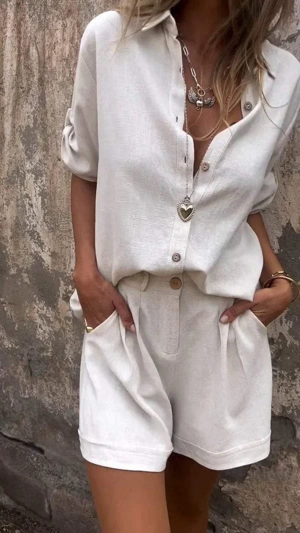 Woman wearing a white lightweight shorts and top set with a relaxed, flowing silhouette