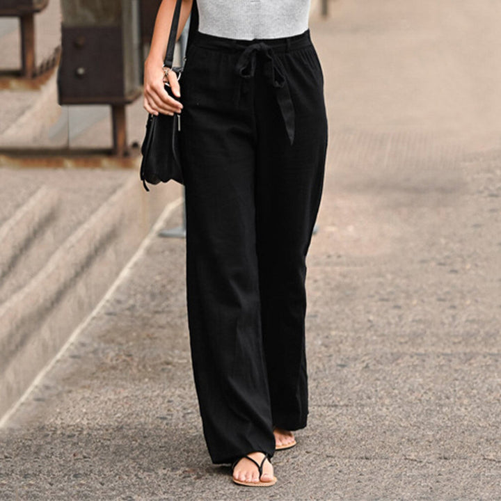 Side view of the Jane wide-leg pants showing the full-length straight leg silhouette