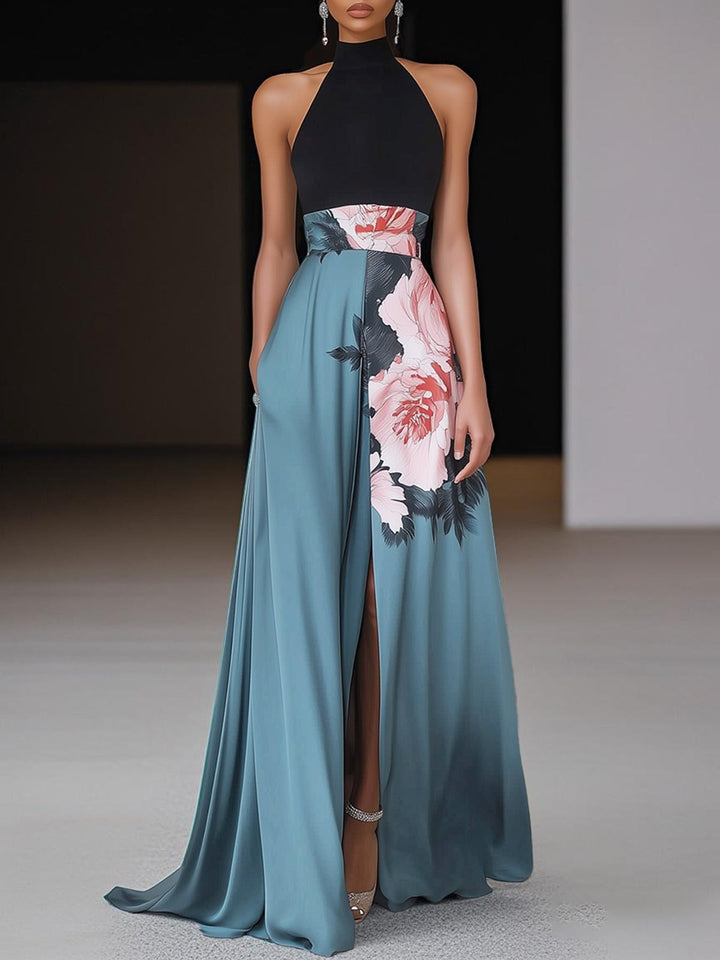 Woman wearing a black floral sleeveless A-line maxi dress with a side slit, front view