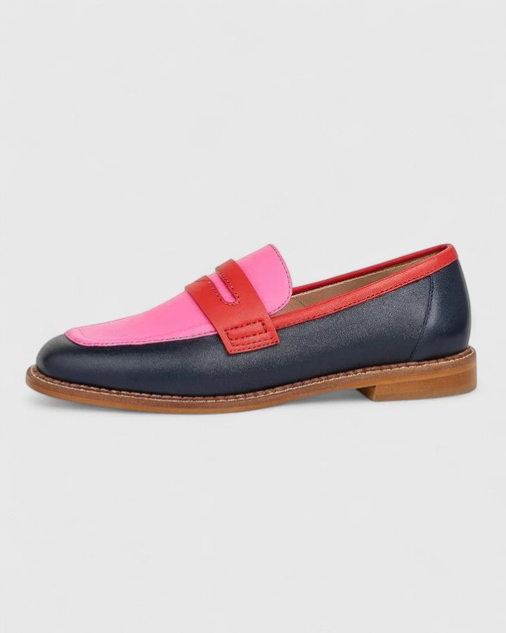 Close-up side view of the Janelle pink loafers showing the cushioned construction and polished finish