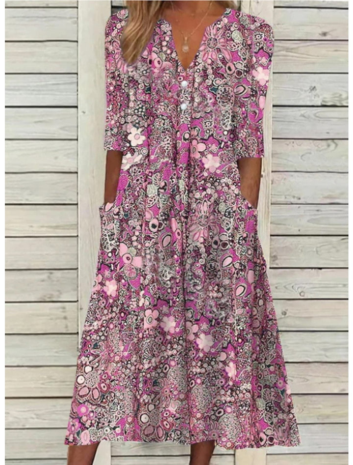 Full-length view of the Florimay Janice summer dress in pink showing graceful draping and relaxed silhouette