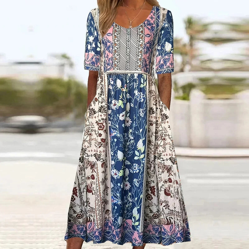 Model wearing boho print dress styled with sandals, relaxed full-length silhouette
