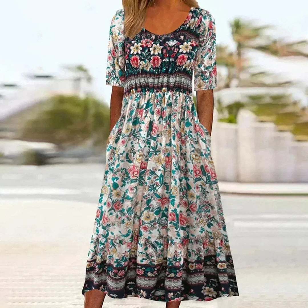 Flat lay of bohemian print dress showing full length and multicolor print detail