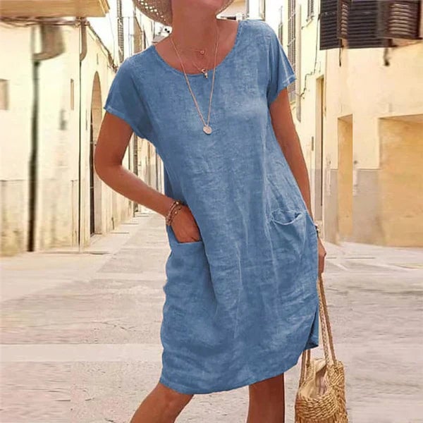 Front view of the Jasmine draped dress in blue highlighting the flattering midsection drape and fluid fabric movement