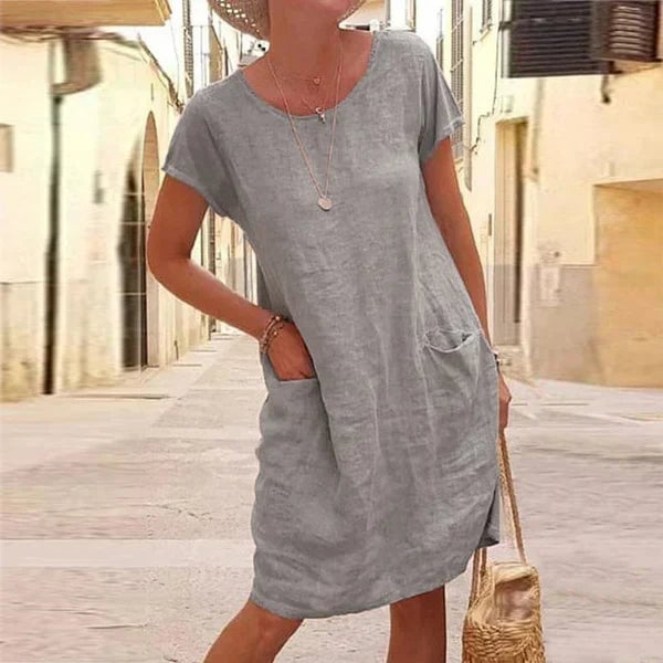 Side profile of the Jasmine tummy control dress in gray demonstrating graceful flow and balanced silhouette