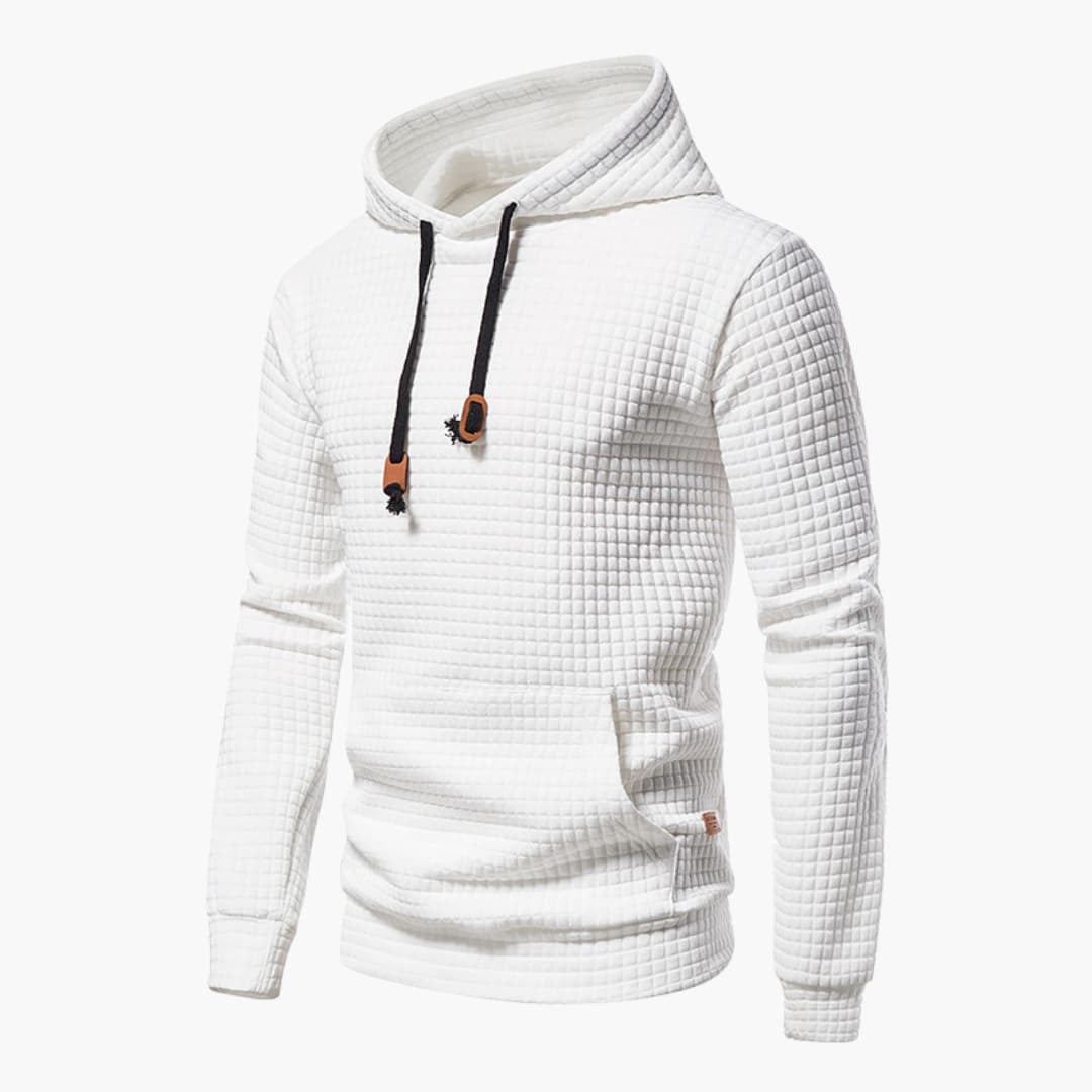 Woman wearing a white checkered comfort hoodie with a snug hood, styled casually