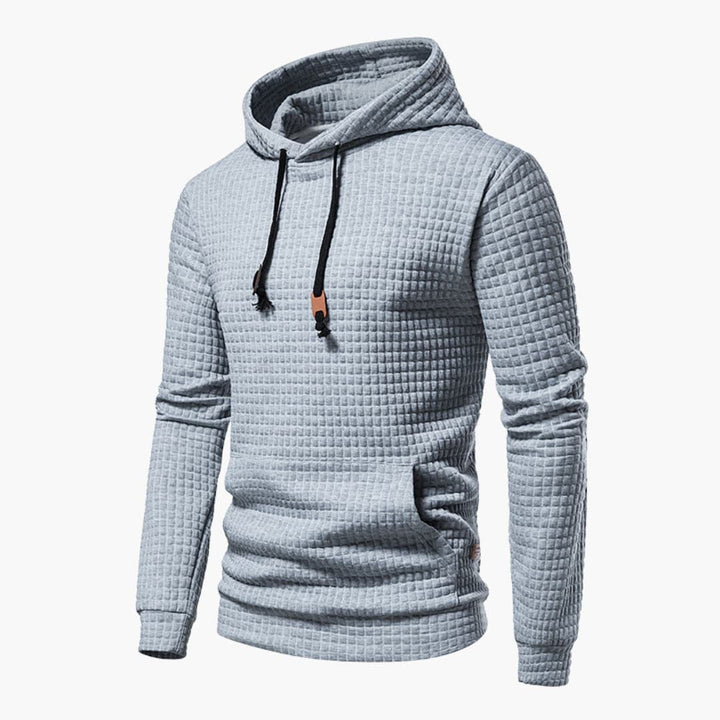 Front view of the Jasper Comfort Hoodie in light grey showing checkered pattern detail