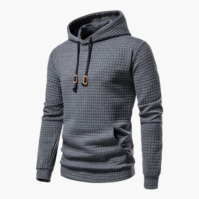 Close-up of the checkered fabric texture on the Jasper Comfort Hoodie in dark grey