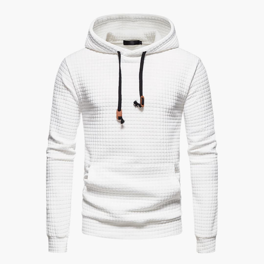 Model wearing the white Jasper Comfort Hoodie paired with light wash jeans