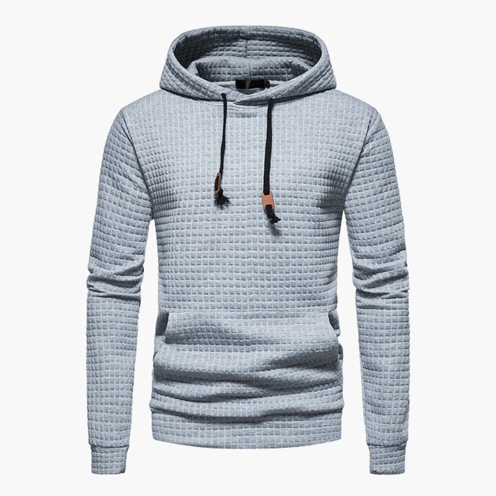 Flat lay of the Jasper Comfort Hoodie in black on a clean white background