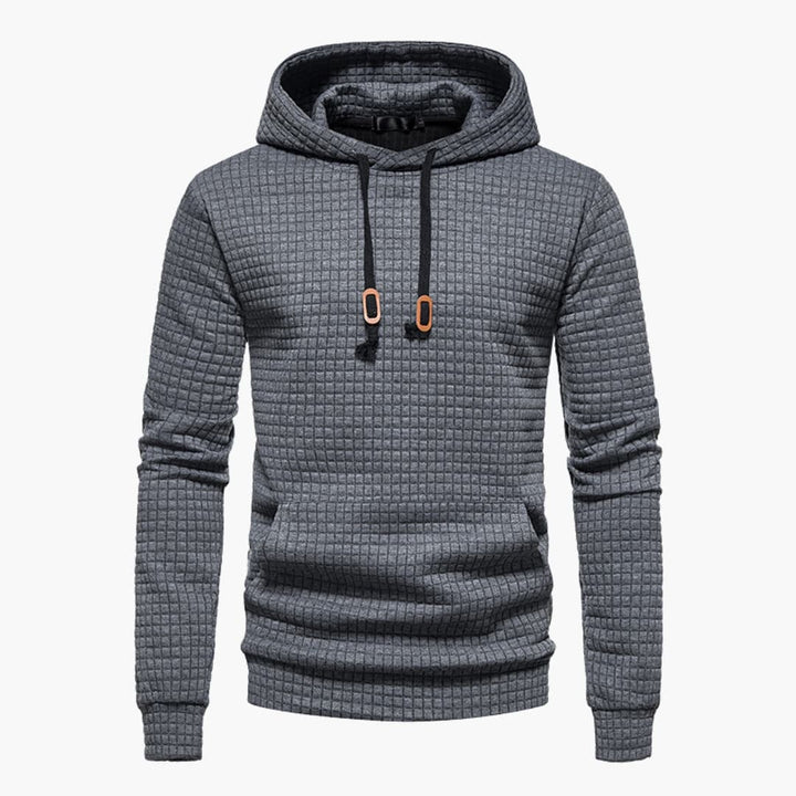 Close-up of sleeve cuff detail on the black Jasper Comfort Hoodie