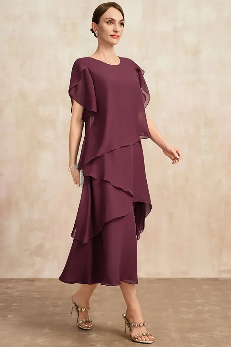 Model in a pink chiffon dress styled for an elegant evening occasion