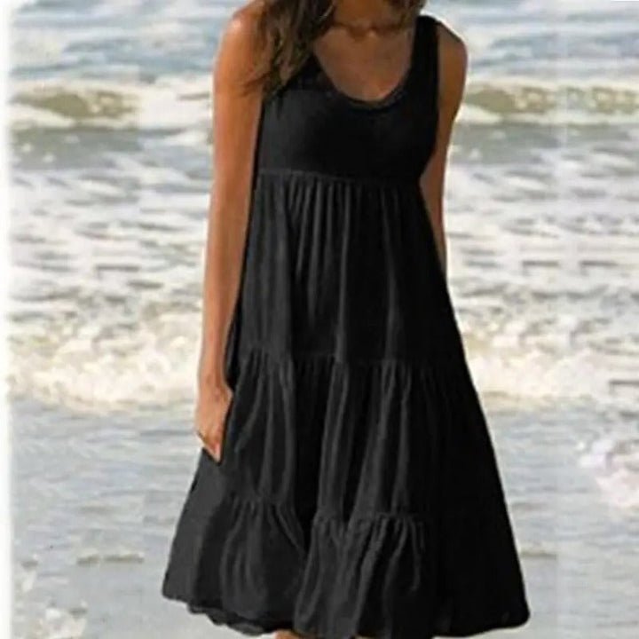 Back view of a black open-back bodycon dress highlighting the chic cutout detail
