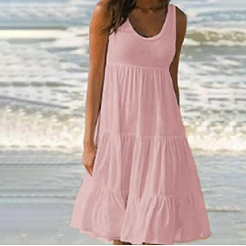 Pink solid bodycon dress styled with heels showing the hem split and slim silhouette