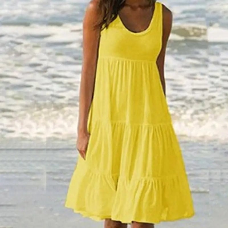 Yellow solid bodycon open-back dress showing the full length and subtle hem split