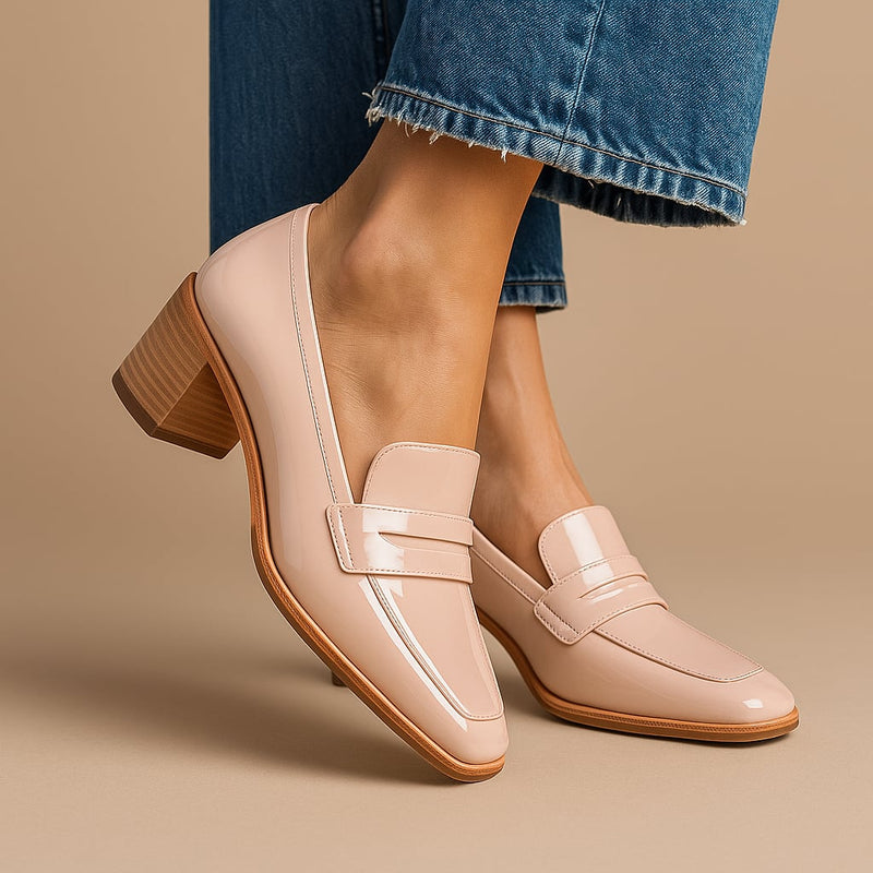 Pink Jemma polished loafers with a glossy finish and streamlined silhouette, shown from a front three-quarter angle