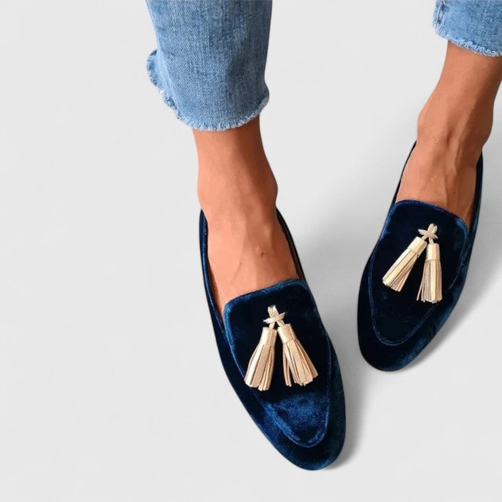 Blue Jenna elegant loafers shown from a front three-quarter angle, featuring a smooth sleek finish and streamlined silhouette