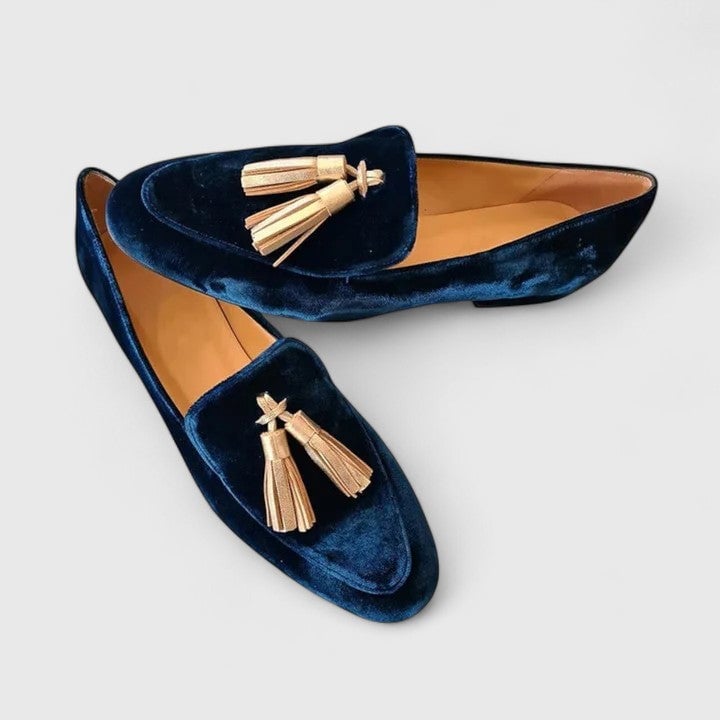 Side profile view of blue Jenna elegant loafers highlighting the flattering elongated shape and polished exterior