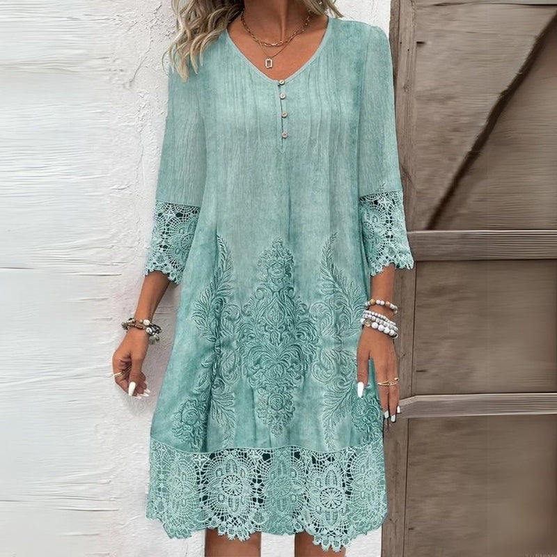 Close-up detail of delicate floral embroidery on a soft, breathable midi dress
