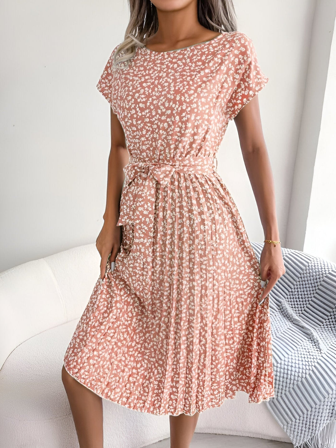 Model wearing the floral pleated A-line dress in Light Blue, showcasing the flowing silhouette