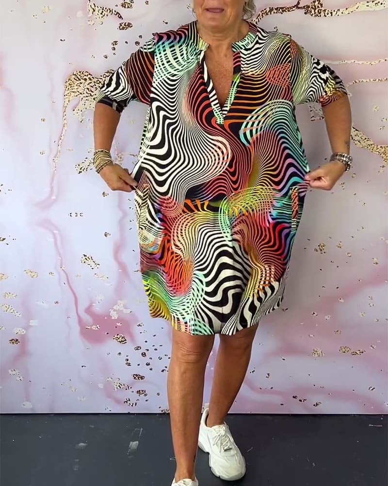 Close-up of the V-neckline detail on a vibrant multicolor dress