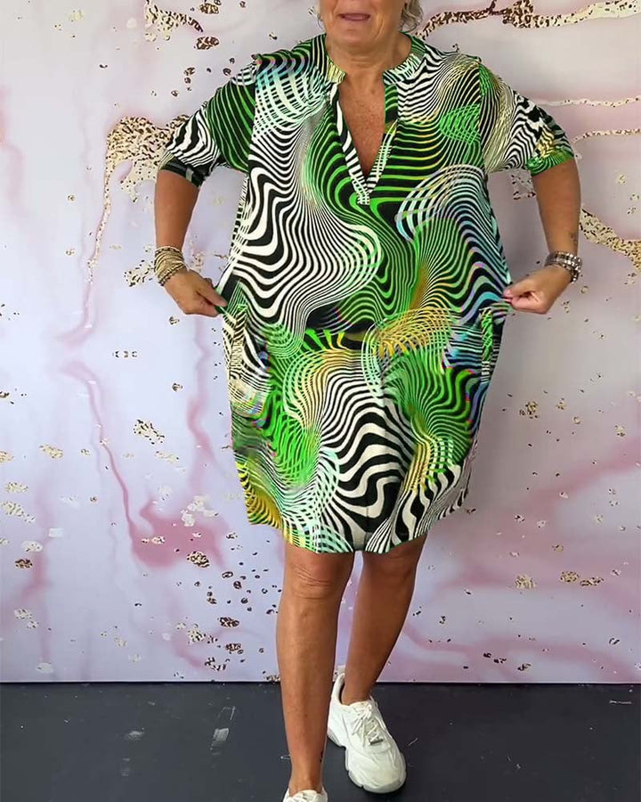 Back view of the colorful V-neck dress showing clean, elegant design