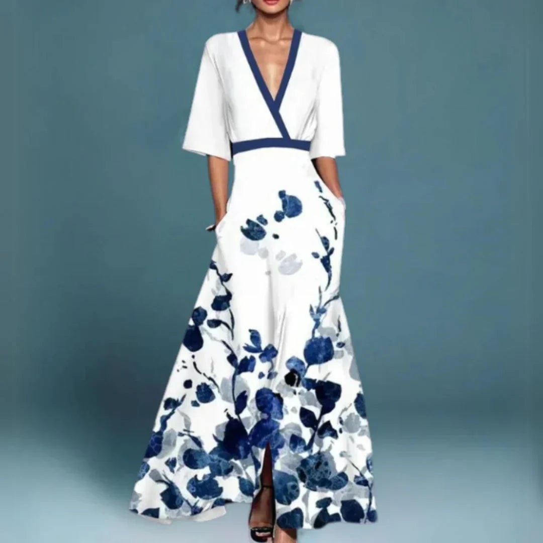 Close-up detail of a romantic floral print on a lightweight maxi dress available in blue and white