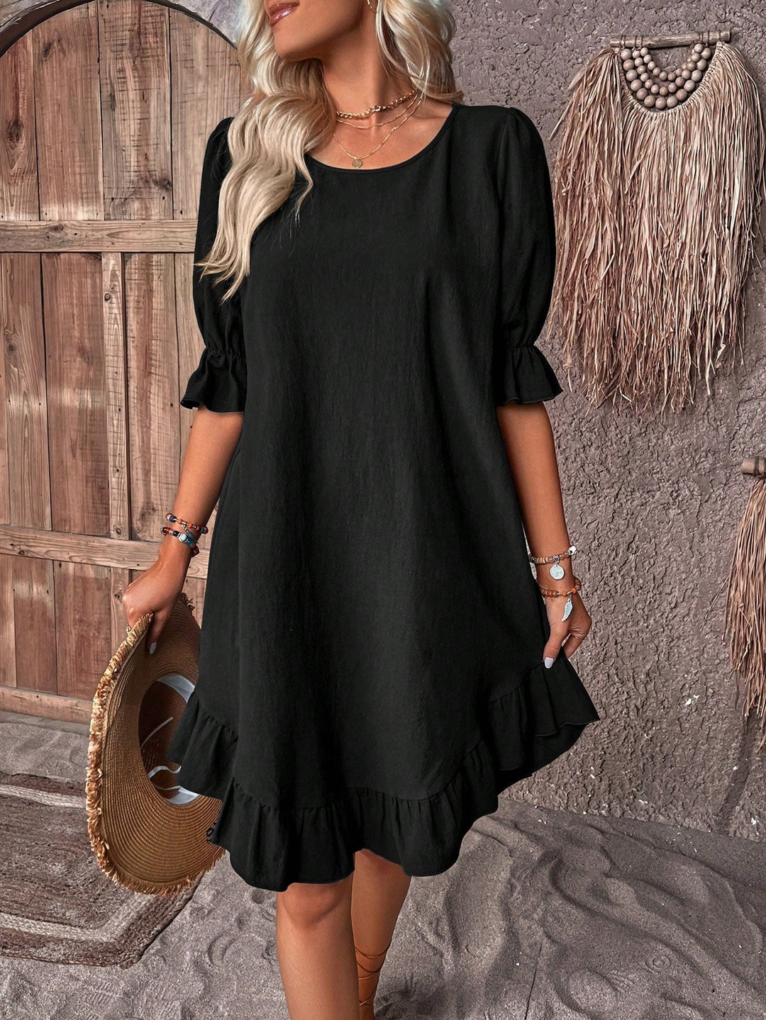 Black ruffle summer dress with tummy coverage displayed on a model, flattering relaxed fit