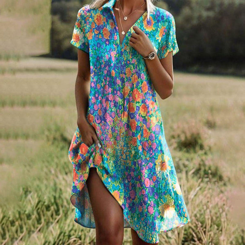 Woman wearing a flowing boho chic summer dress in a vibrant multicolor print, styled with sandals outdoors