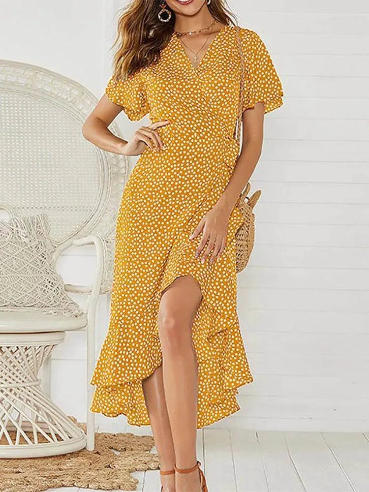Close-up of ruffle neckline and floral print on a lightweight summer maxi dress in yellow