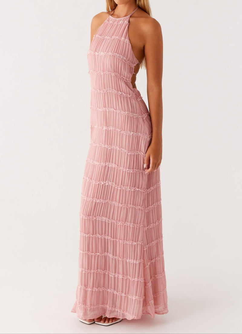 Close-up of pink halter maxi dress showing smooth fabric drape and adjustable neckline tie