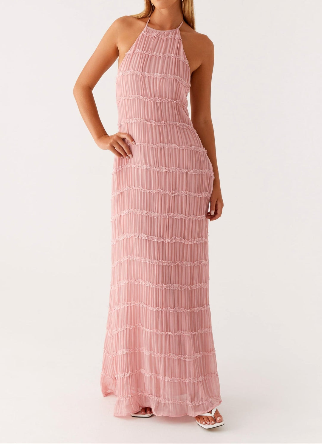 Black halter maxi dress on model highlighting sleek silhouette and clean neckline