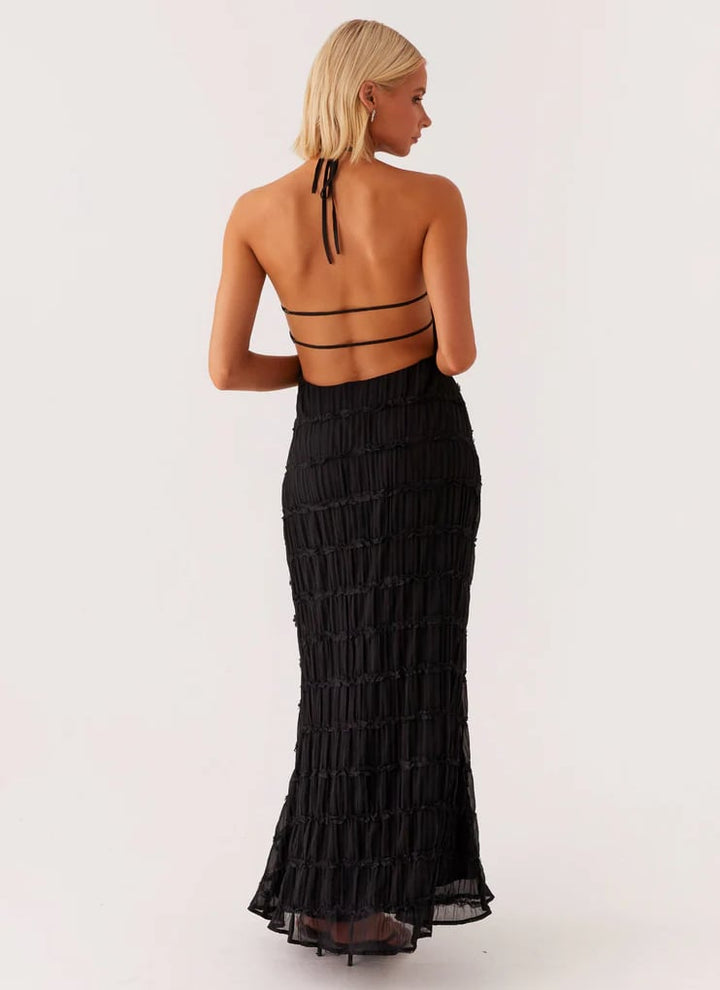 Model in pink halter maxi dress showing smooth, non-sheer fabric and flattering drape