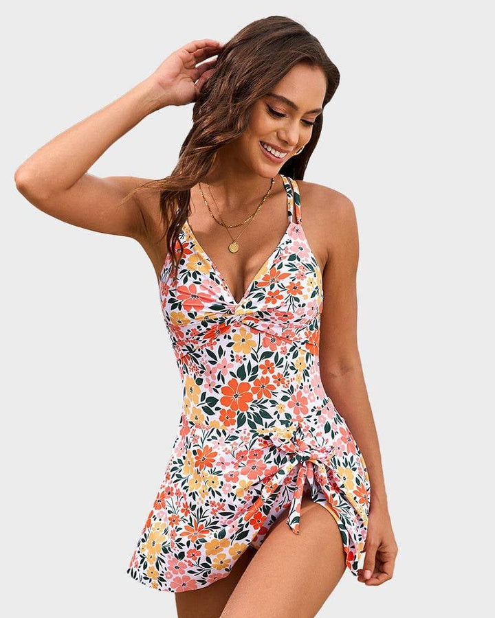 Side view of pink floral swim dress highlighting the skirted overlay and figure-flattering shape