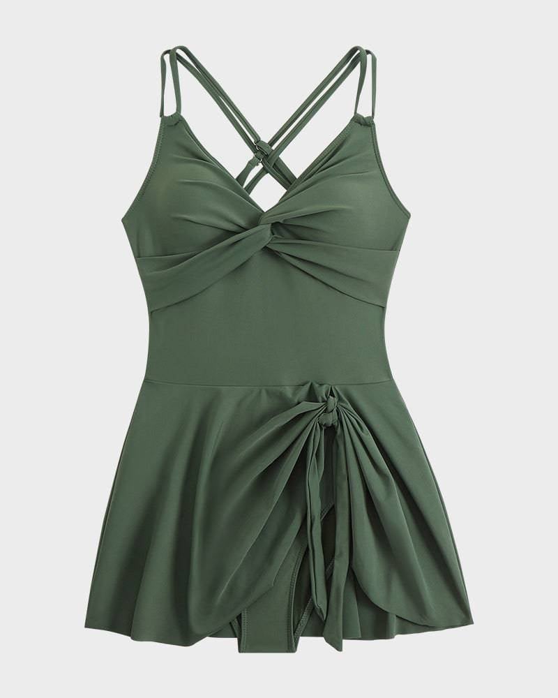Front view of black flattering swim dress with tummy control and elegant knot detail