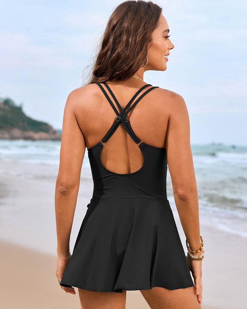 Full-length view of pink floral swim dress on a model, highlighting the adjustable straps and elegant fit