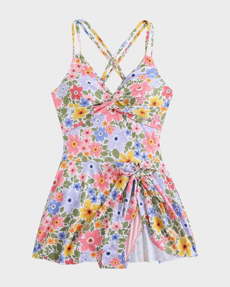 Orange floral swim dress full-length front view on a model at a sunny beach location