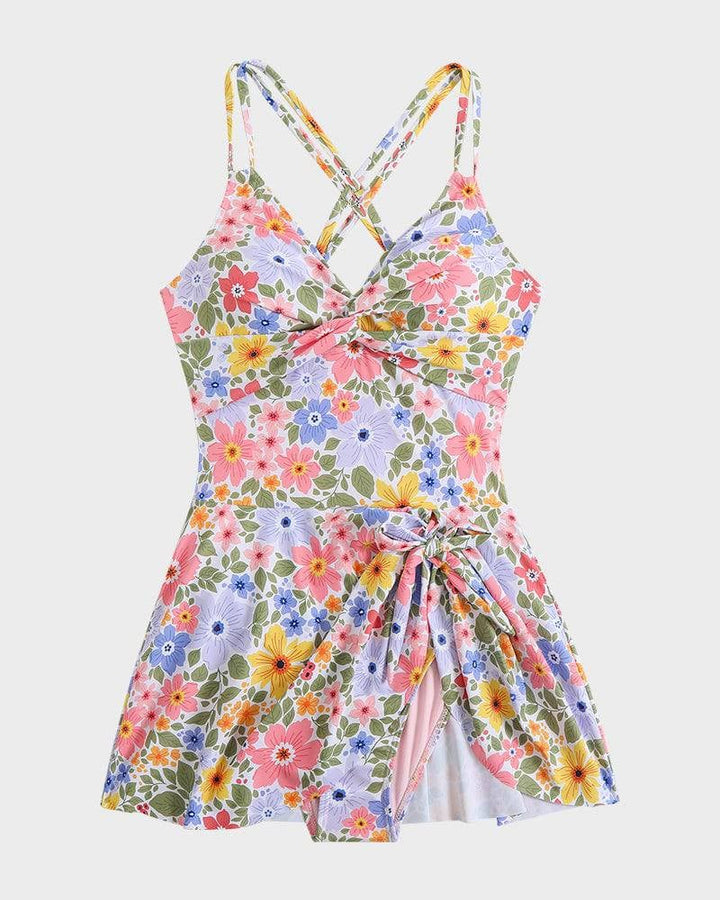 Orange floral swim dress full-length front view on a model at a sunny beach location