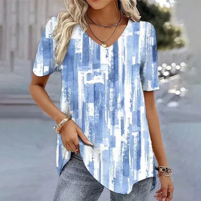 Full-length view of women's striped V-neck tee styled with high-waist jeans