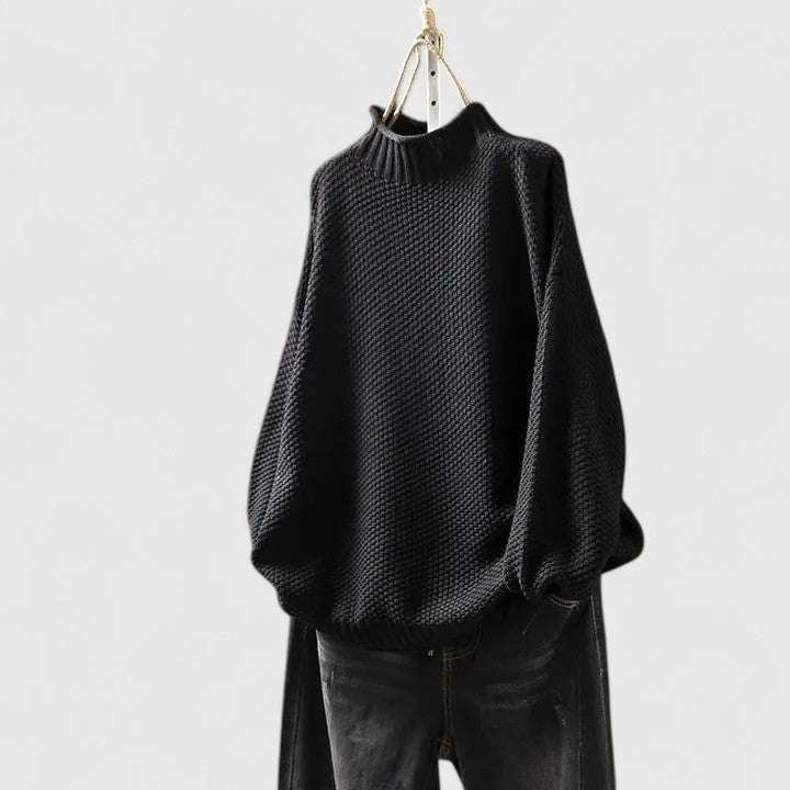 Jordyn sophisticated sweater in black displayed on a model with a polished, feminine silhouette
