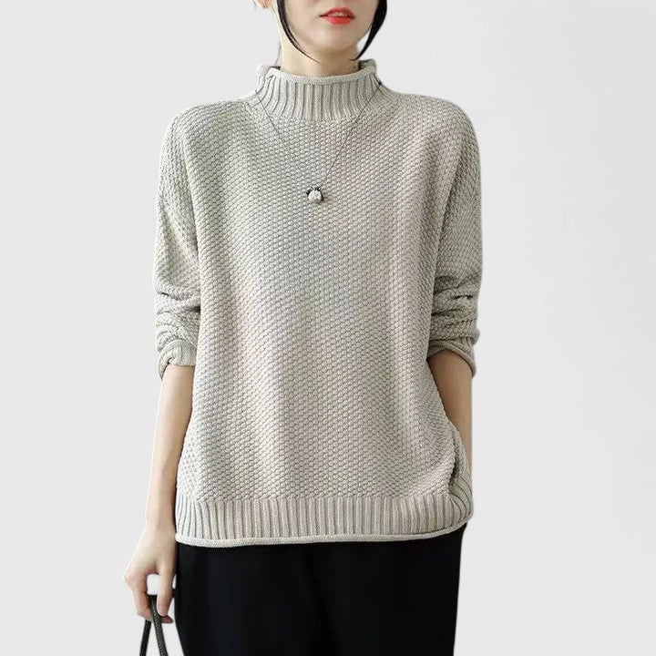Model wearing the Jordyn sophisticated sweater in green against a neutral background