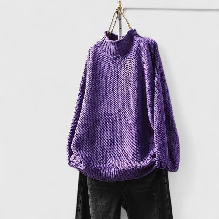 Jordyn sophisticated sweater in beige laid flat to show color and fabric detail