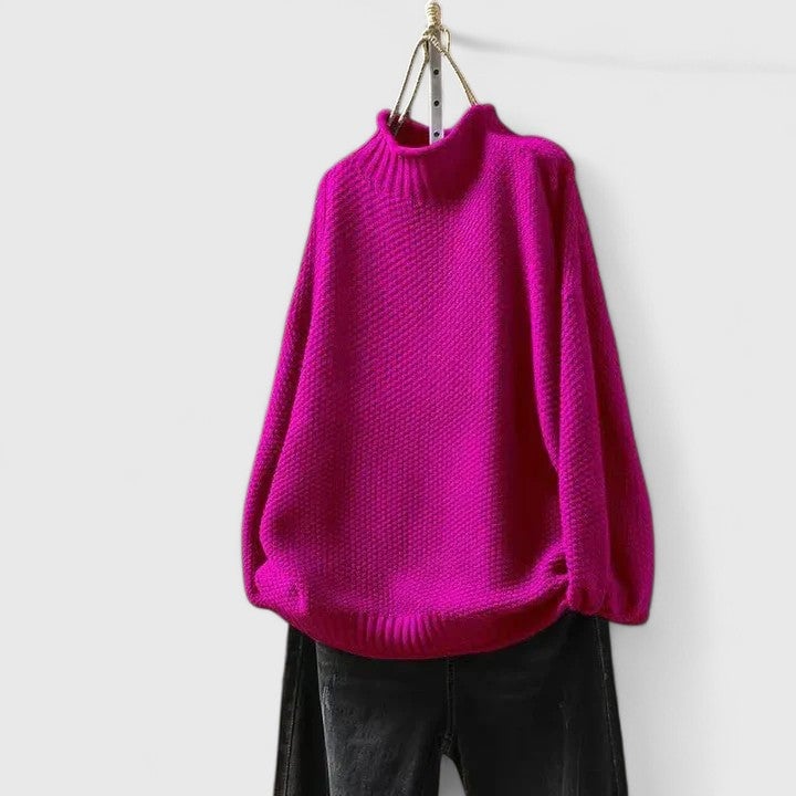 Full-length shot of model wearing the Jordyn sophisticated sweater in red with heels