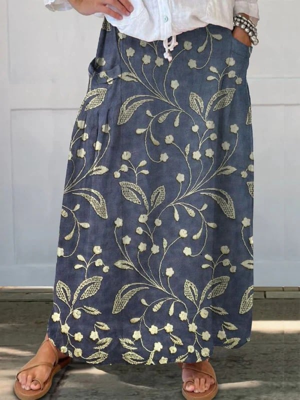 Blue retro floral A-line skirt with elastic waistband and side pockets, shown in full length