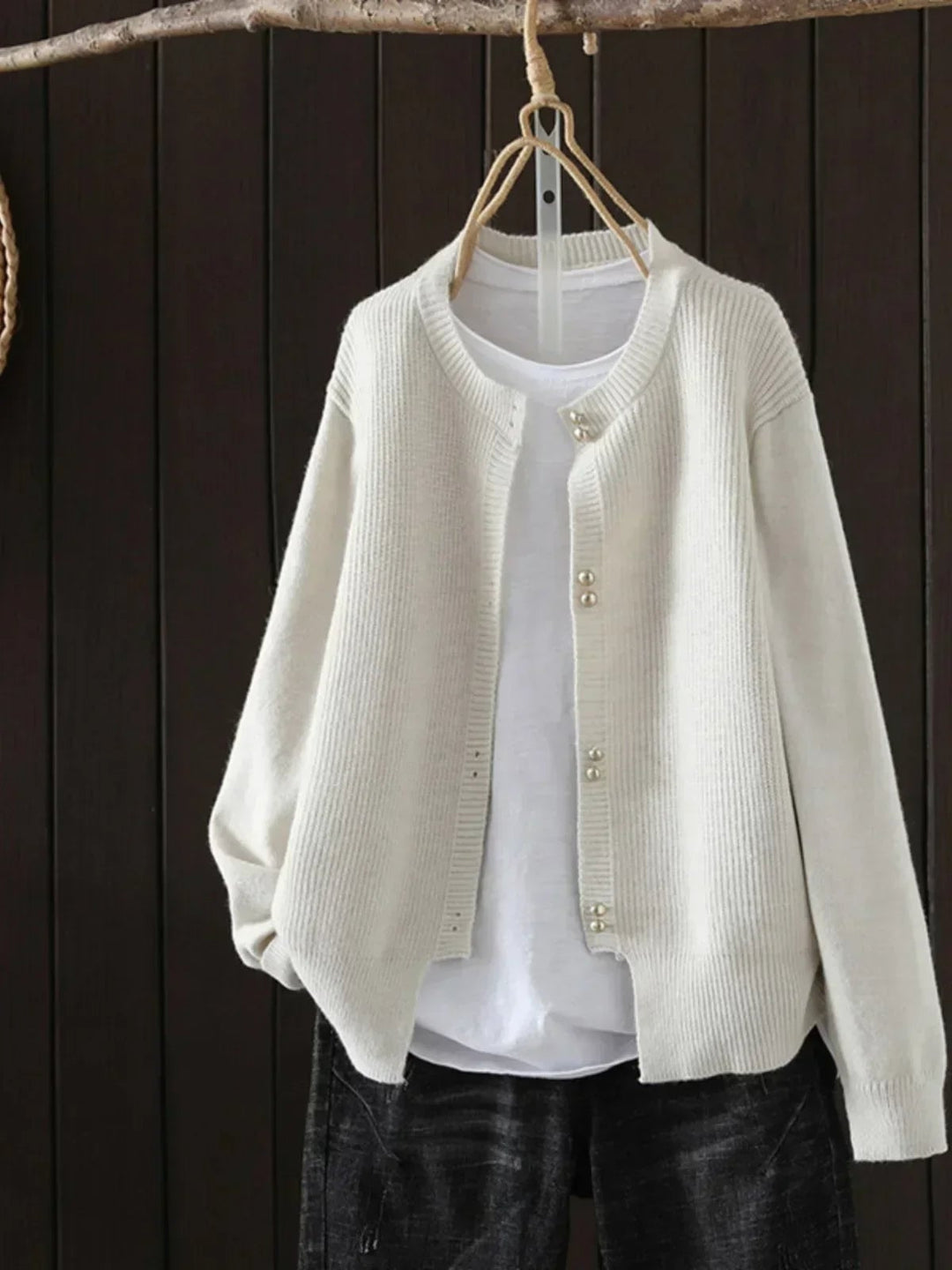 Woman wearing the Josephine cardigan in pink, showcasing its flattering relaxed fit