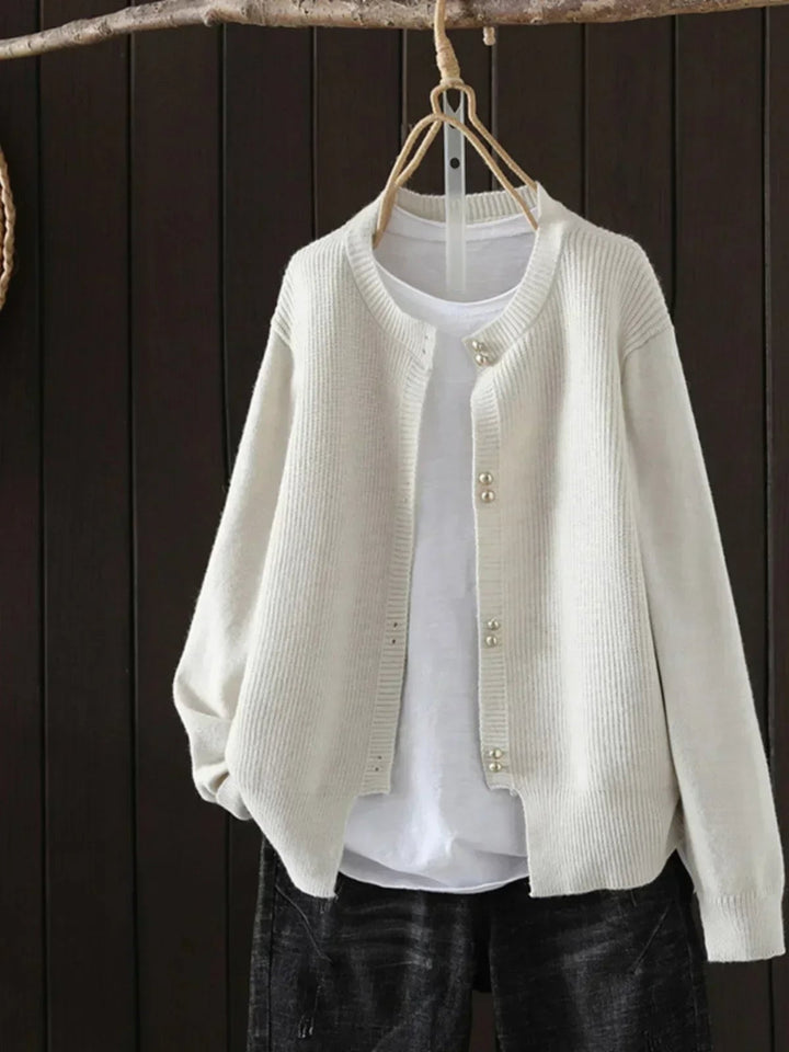 Woman wearing the Josephine cardigan in pink, showcasing its flattering relaxed fit