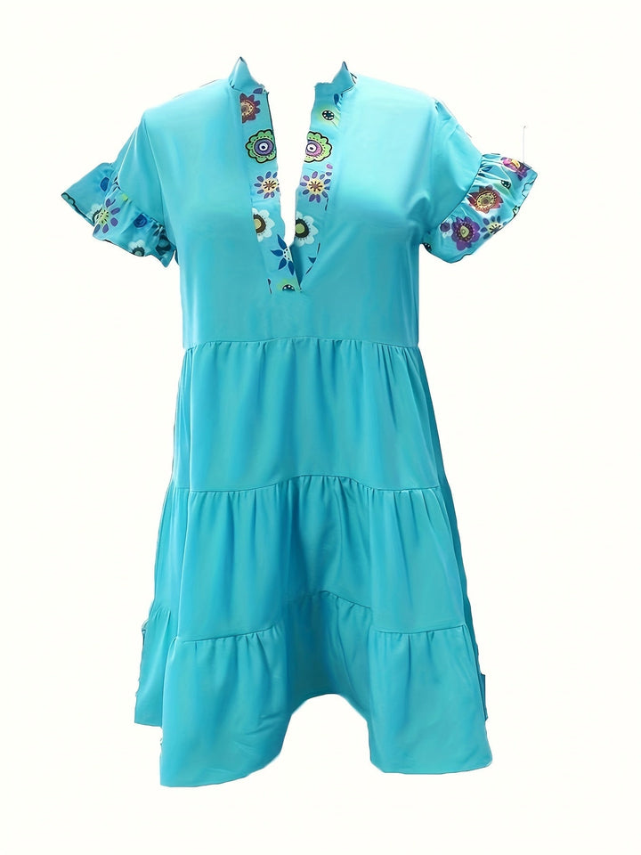 Woman in a blue Josephine boho cocktail dress styled for a casual summer occasion, side view