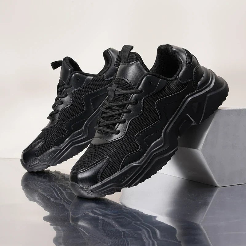 Josephine black walking sneakers angled front view showing toe box and sole