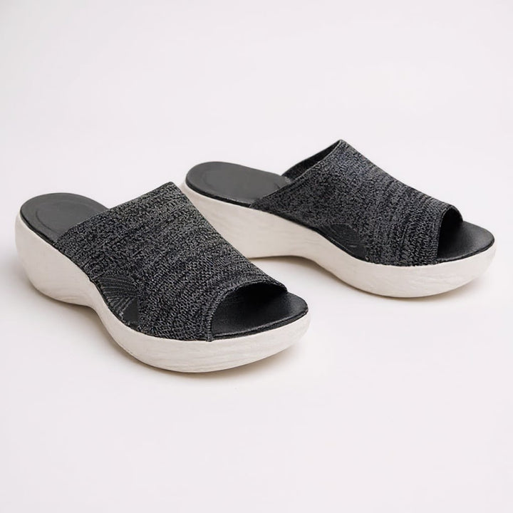 Close-up of Jovie adjustable strap sandal showing arch support footbed detail in blue